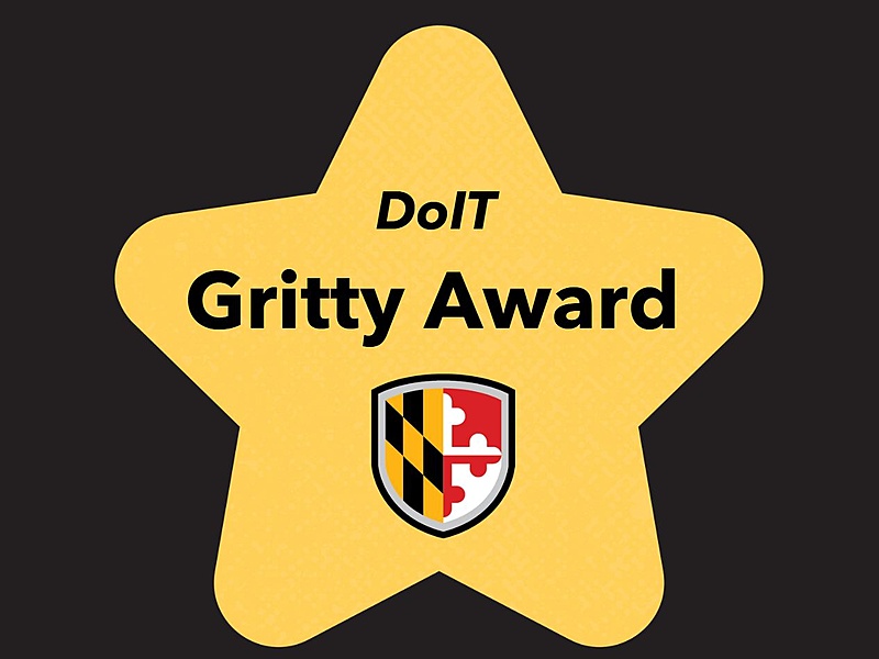 Gold star with the UMBC shield and the text DoIT Gritty Award