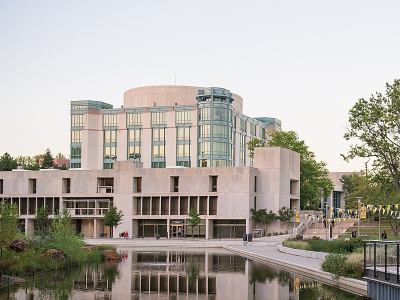 Picture of the library with the pond in the foreground