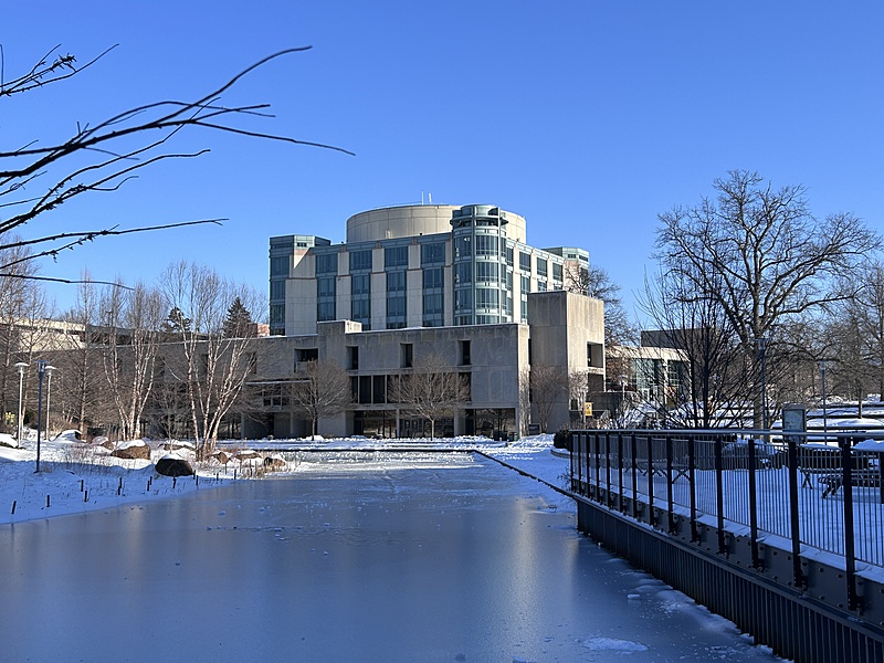 frozen pond with AOK Library in background