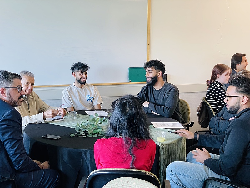 Photo of people talking a table