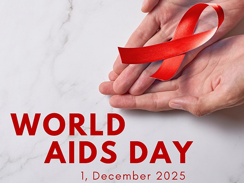 A red ribbon in the palm of someone's hands. The text reads "World AIDS Day, 1 December 2025"