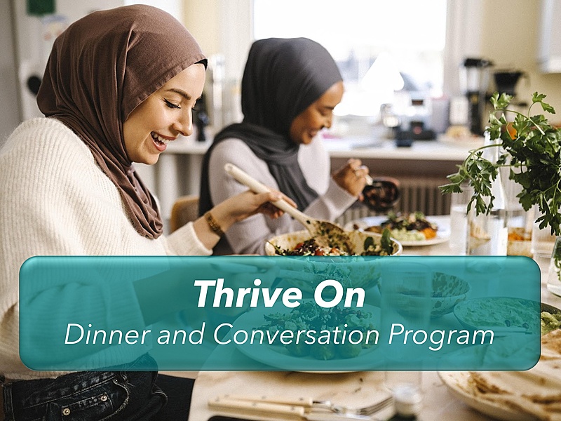 Two people eating with event title superimposed on top