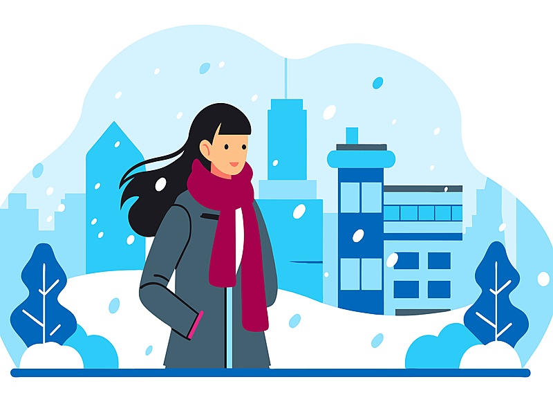 a female college student walks in snowy weather