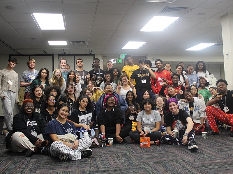 STRiVE participants and coaches pose for a group photo while smiling and wearing pajamas.