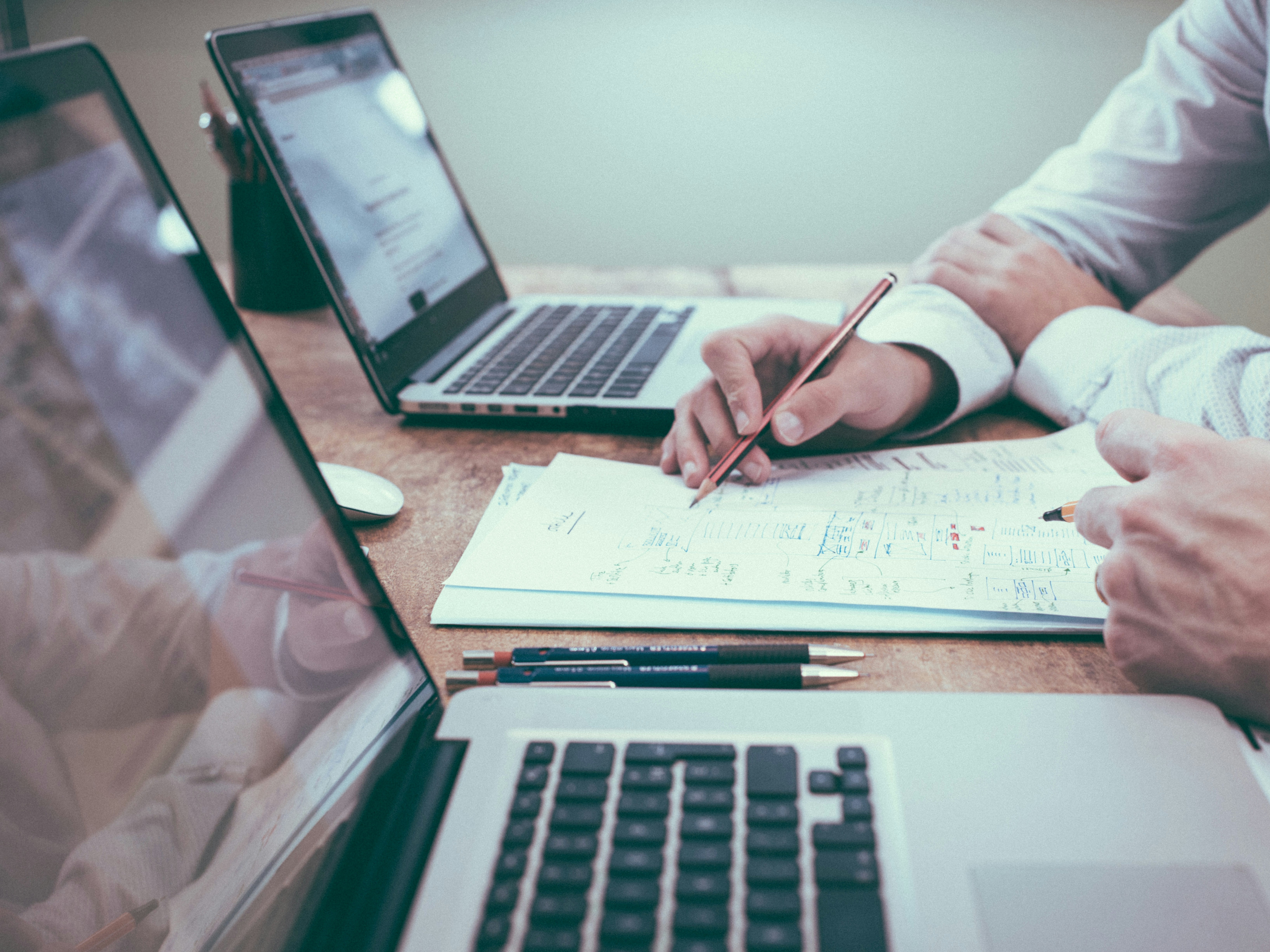 image of two researchers with laptops