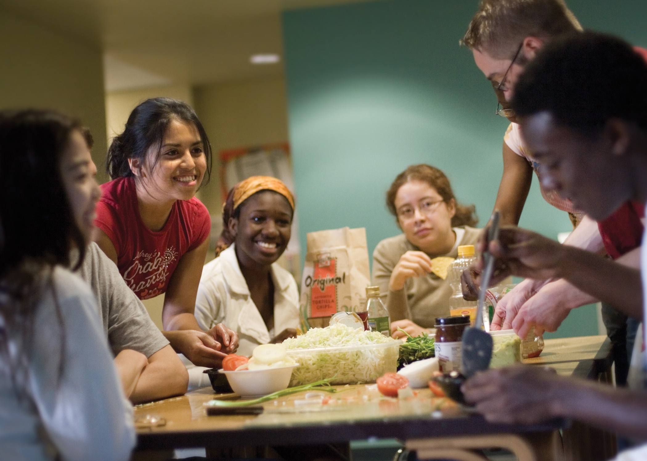 several UMBC students gathering around a table