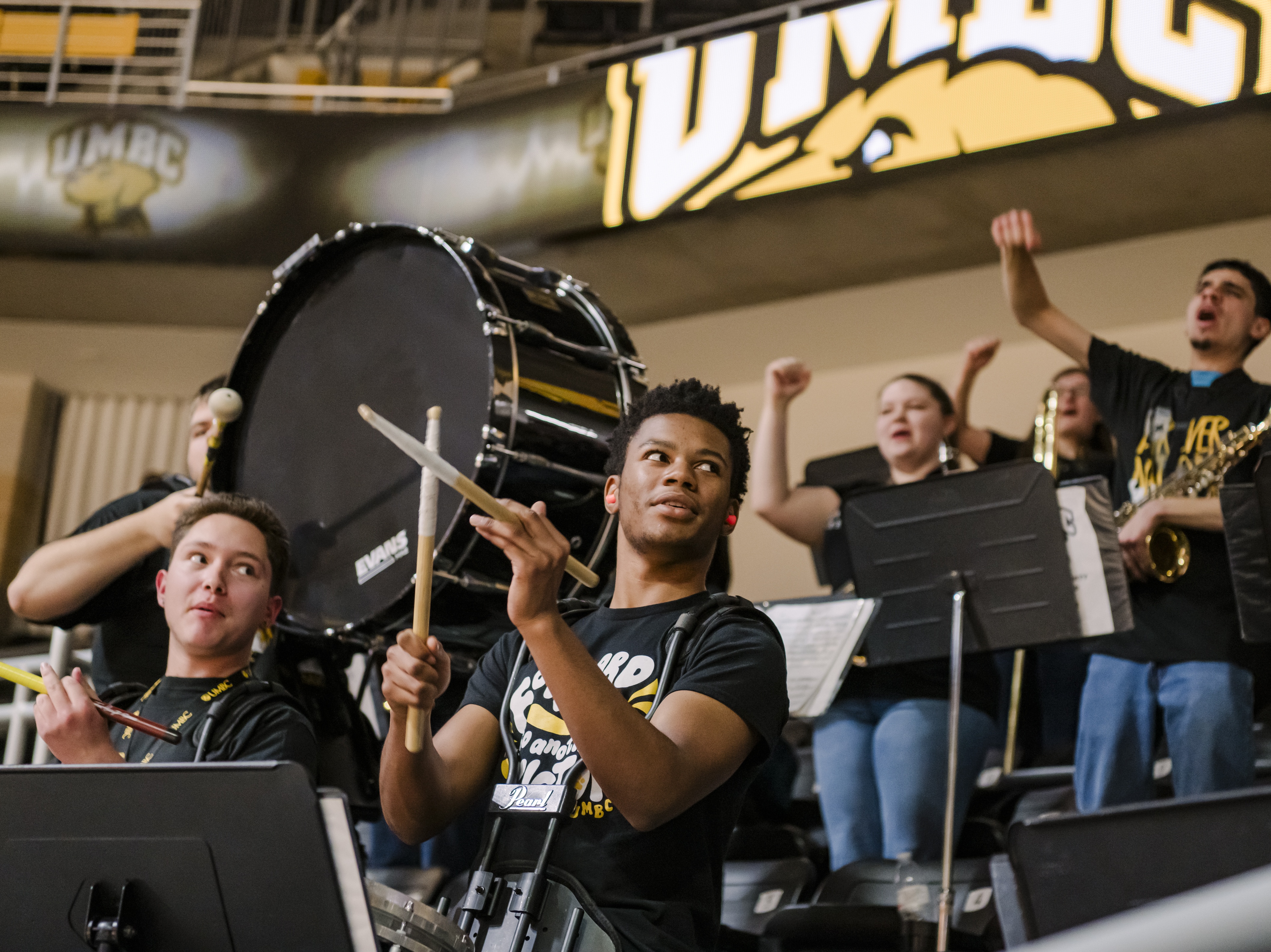 UMBC pep band students playing in the arena
