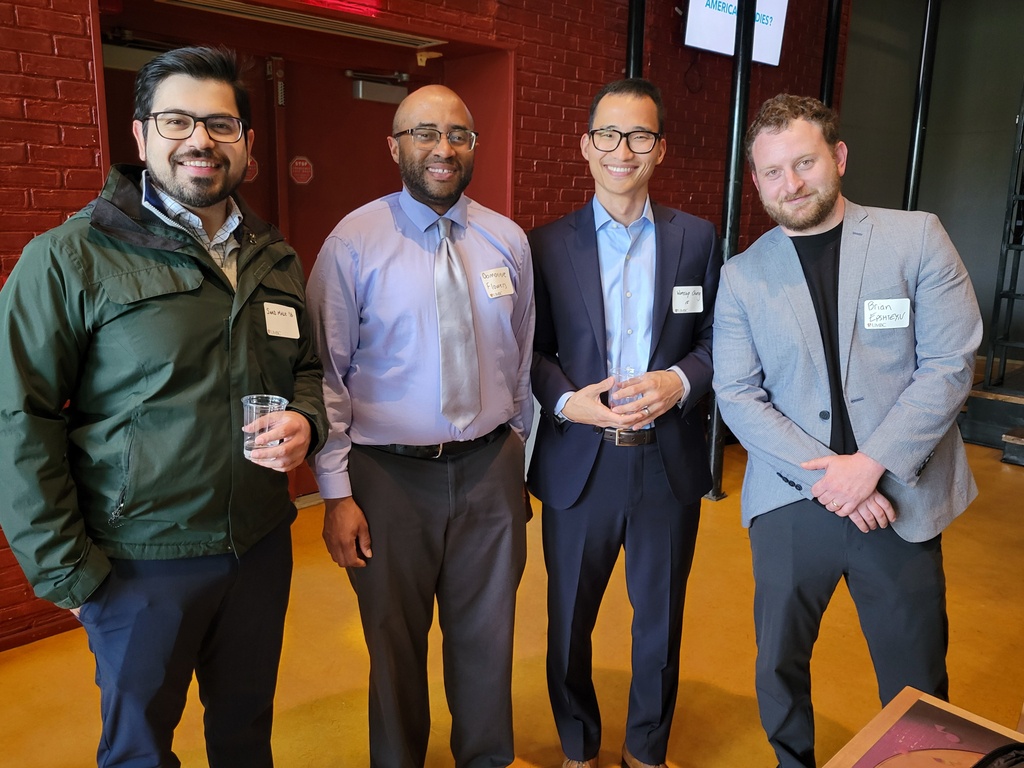 Image of four UMBC alumni at 2024 Pre-Law Networking Social.